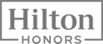 This is the Hilton Honors logo, featuring the text "Hilton" in large font and "Honors" below it in smaller font, all within a rectangular frame.
